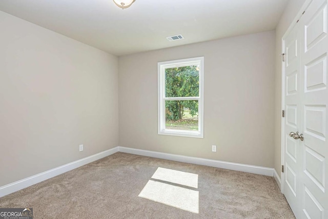 view of carpeted spare room