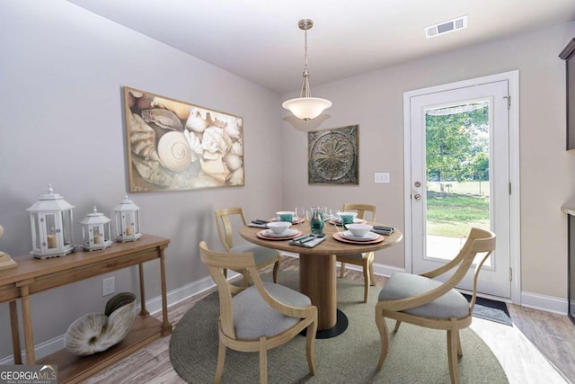 dining area with light hardwood / wood-style flooring