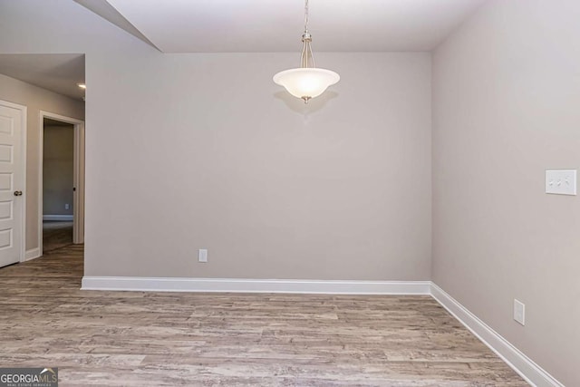 spare room featuring light hardwood / wood-style flooring