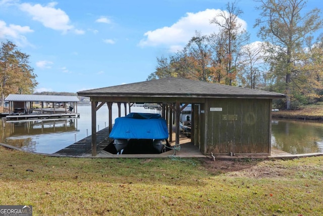 dock area featuring a yard and a water view