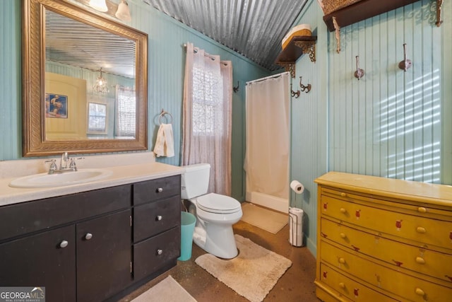 bathroom featuring vanity, curtained shower, and toilet