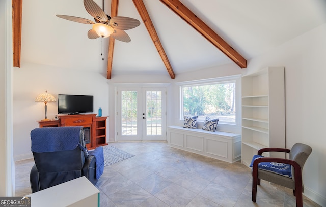 living room featuring vaulted ceiling with beams, ceiling fan, and french doors