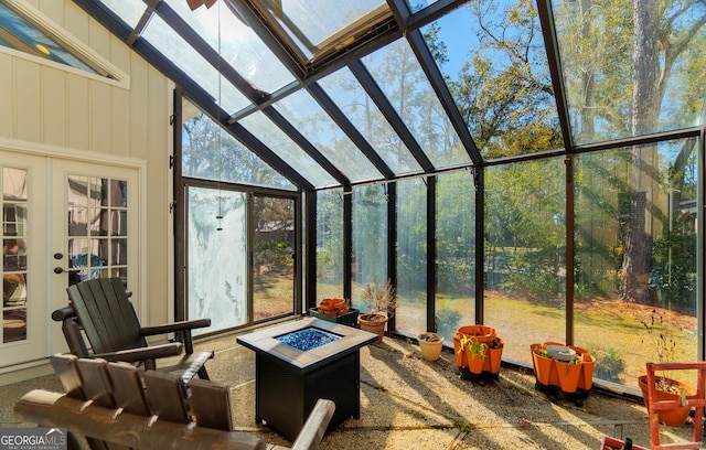 sunroom / solarium featuring vaulted ceiling