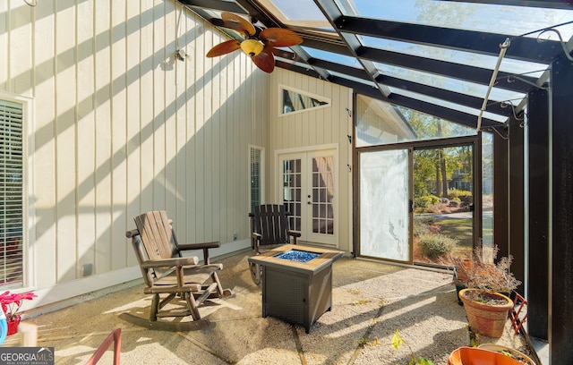 view of patio / terrace with french doors, ceiling fan, and an outdoor fire pit