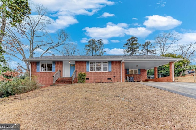 single story home featuring a carport and a front yard