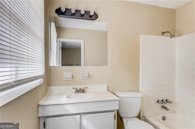 full bathroom with vanity, shower / bathtub combination, and toilet