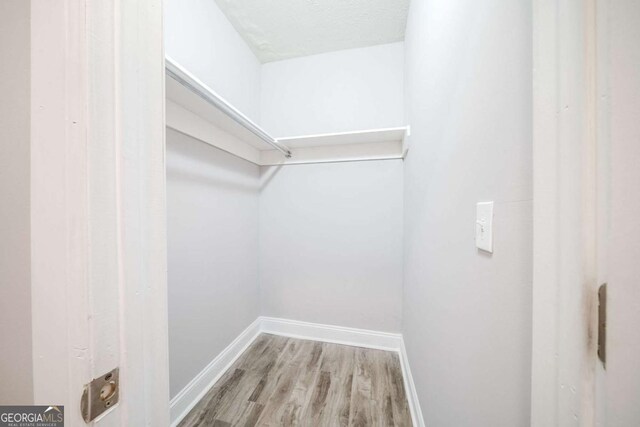 3693 Aldea Dr, Decatur, GA 30032 - spacious closet featuring hardwood / wood-style floors