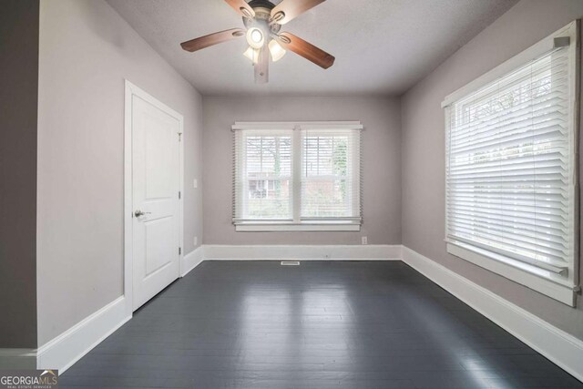 3693 Aldea Dr, Decatur, GA 30032 - spare room with dark hardwood / wood-style floors and ceiling fan