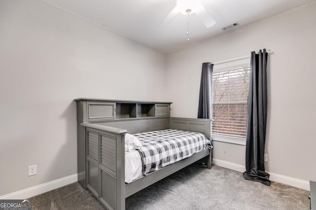 bedroom with ceiling fan and light colored carpet