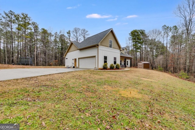 view of home's exterior with a storage shed and a yard