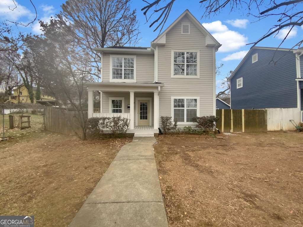 view of property featuring a porch