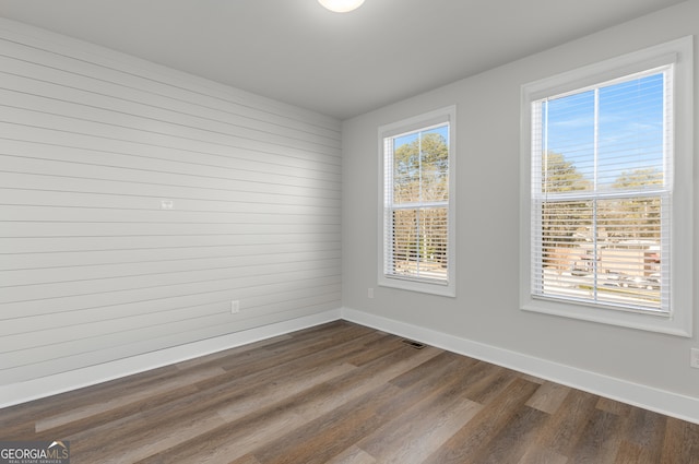 empty room featuring dark hardwood / wood-style floors