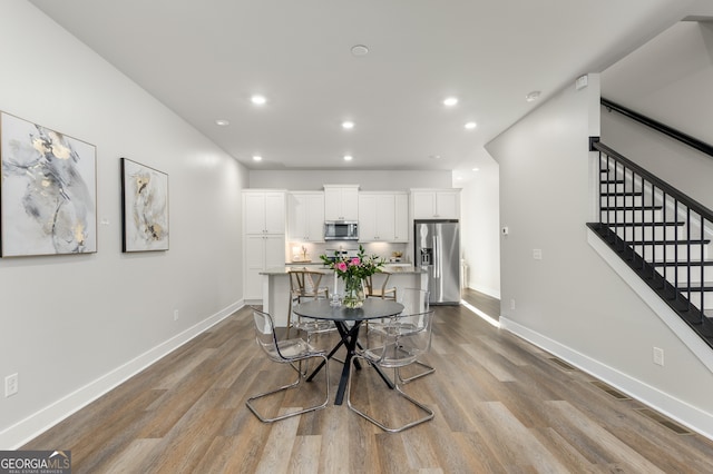 dining room with light hardwood / wood-style flooring