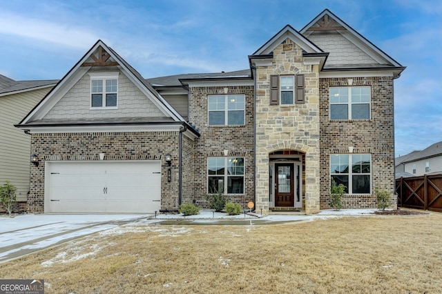 view of front of property with a garage and a front lawn