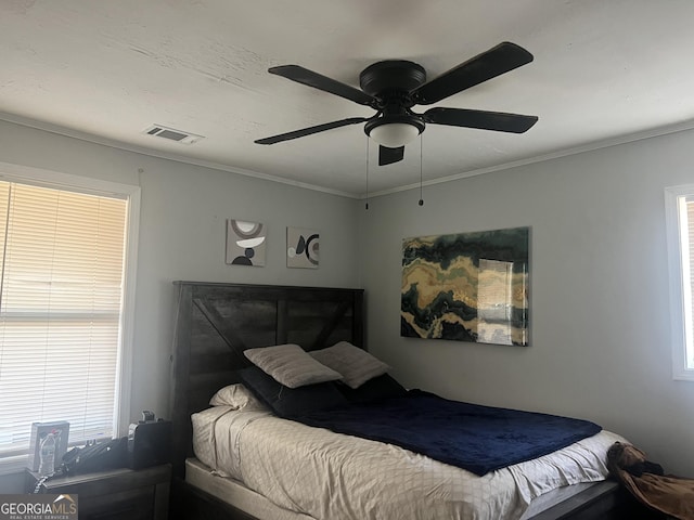 bedroom featuring crown molding and ceiling fan