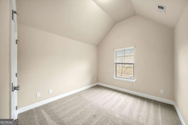 bonus room featuring vaulted ceiling and carpet flooring