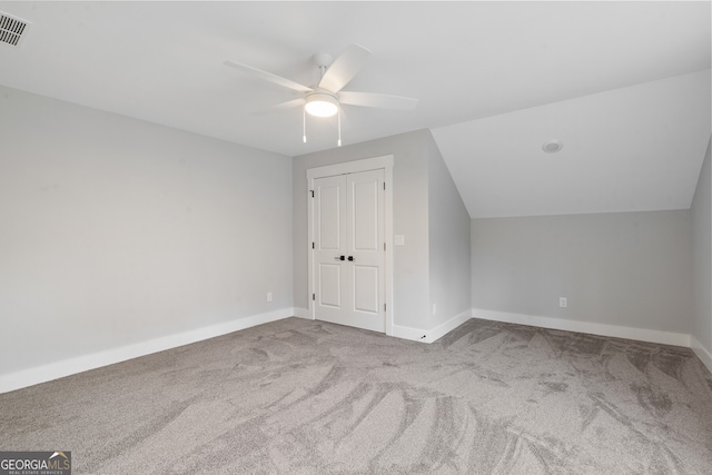 bonus room with lofted ceiling, light colored carpet, and ceiling fan