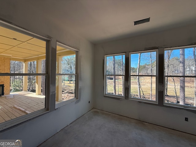 unfurnished sunroom featuring a wealth of natural light