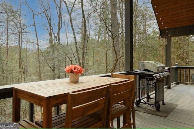 wooden terrace featuring grilling area