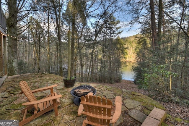 view of patio / terrace with a fire pit