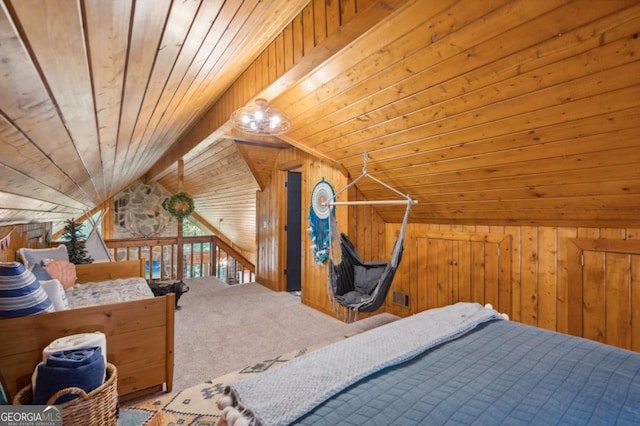 bedroom with wooden walls, vaulted ceiling, carpet, and wooden ceiling