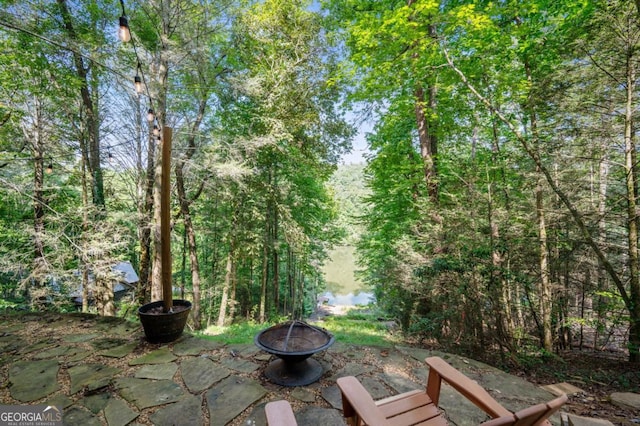 view of patio featuring an outdoor fire pit