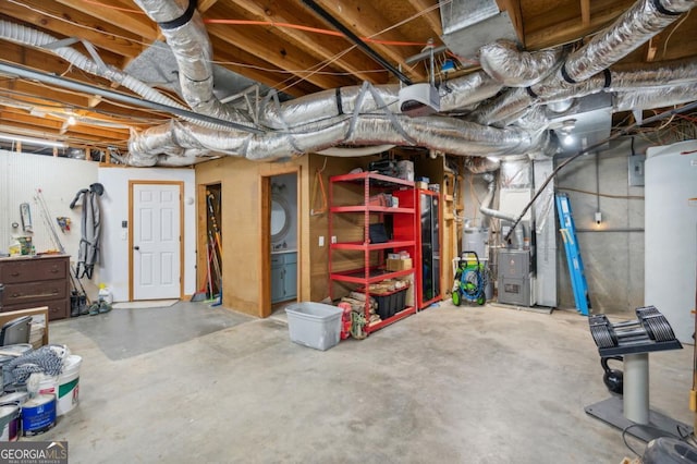 basement featuring water heater and heating unit