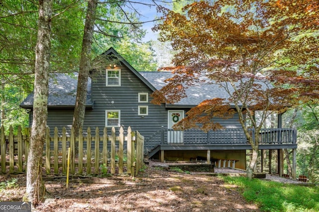 back of house featuring a deck