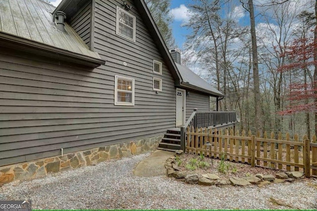 view of property exterior featuring a deck