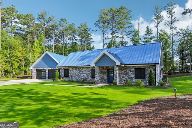 view of front of property with a garage and a front yard