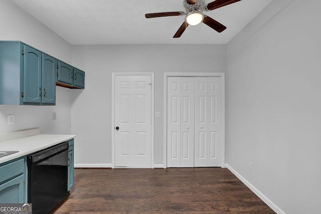 kitchen with dark hardwood / wood-style floors, blue cabinets, dishwasher, ceiling fan, and a textured ceiling