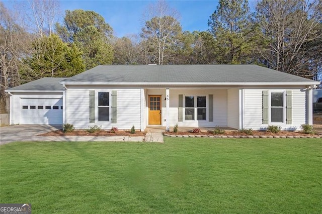 ranch-style home with a garage and a front lawn