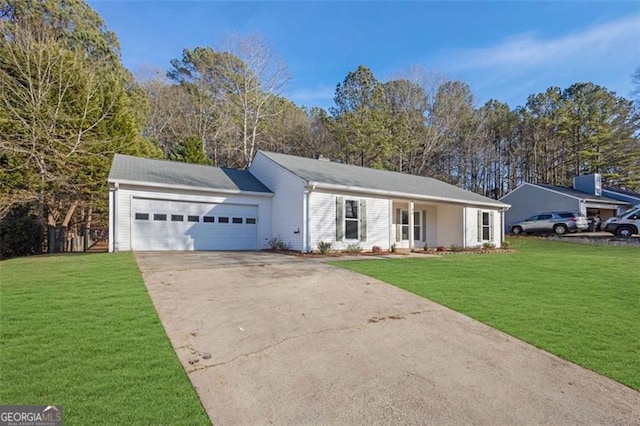 ranch-style home with a garage and a front lawn