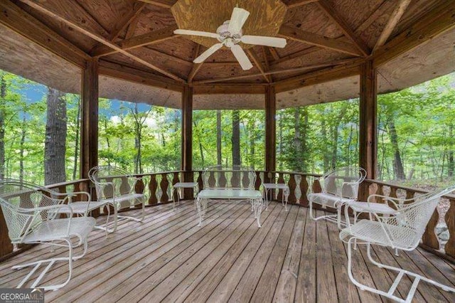 deck with a gazebo and ceiling fan