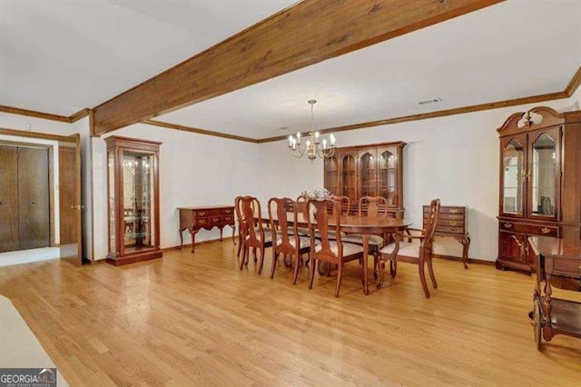 dining space featuring beamed ceiling, crown molding, a notable chandelier, and light hardwood / wood-style floors