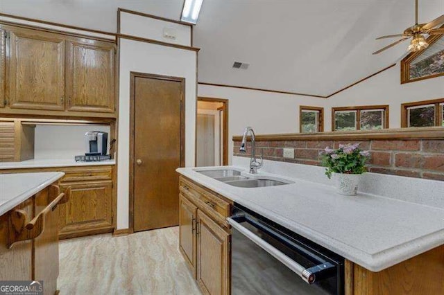 kitchen featuring lofted ceiling, sink, a center island, dishwashing machine, and ceiling fan