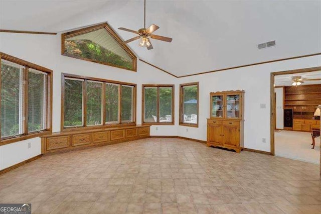 unfurnished sunroom with lofted ceiling and ceiling fan