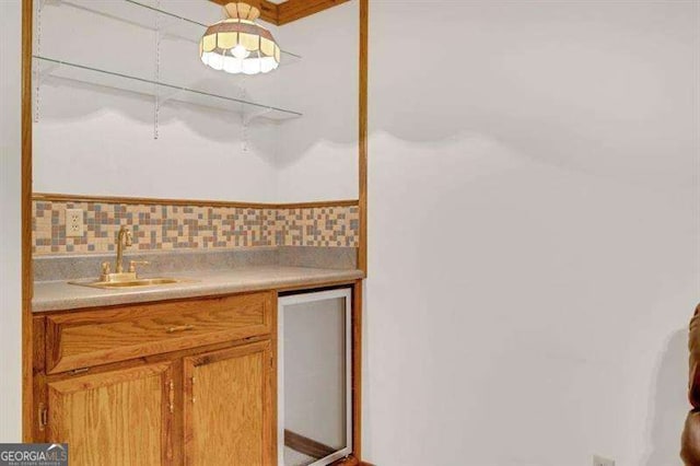 interior space featuring vanity and backsplash