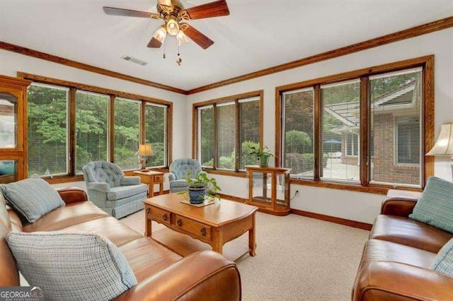 sunroom with a healthy amount of sunlight and ceiling fan