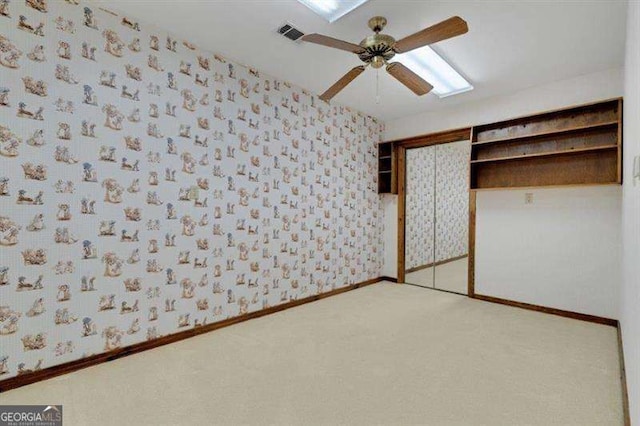 unfurnished bedroom with a closet and ceiling fan