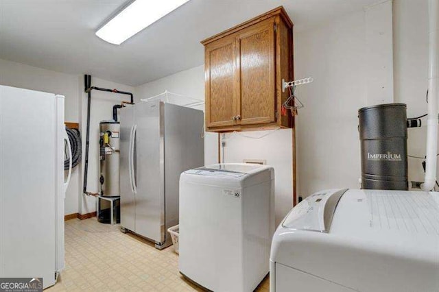 laundry area with cabinets and washer and dryer