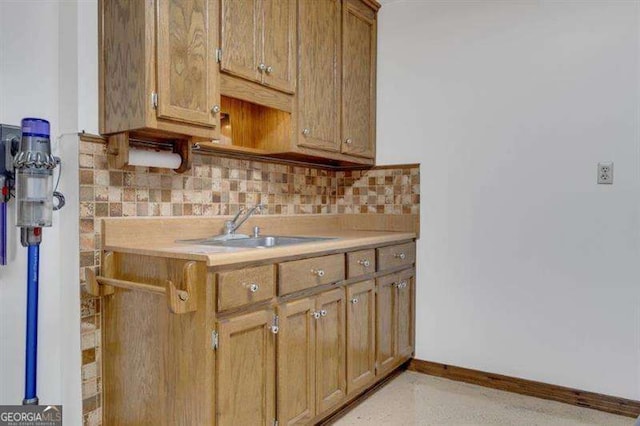 kitchen with tasteful backsplash and sink