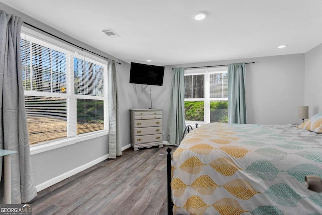 bedroom with hardwood / wood-style flooring