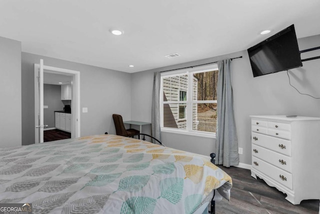 bedroom featuring dark hardwood / wood-style floors