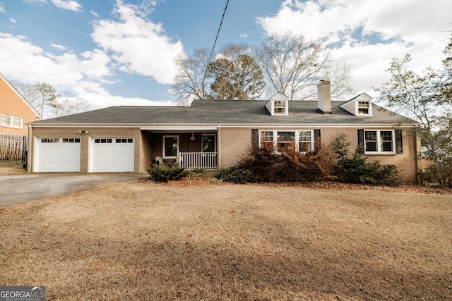 view of front of property with a garage and a porch