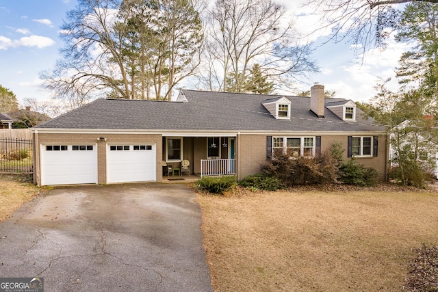 view of front of home with a garage and covered porch