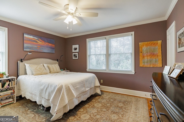 bedroom featuring crown molding and ceiling fan