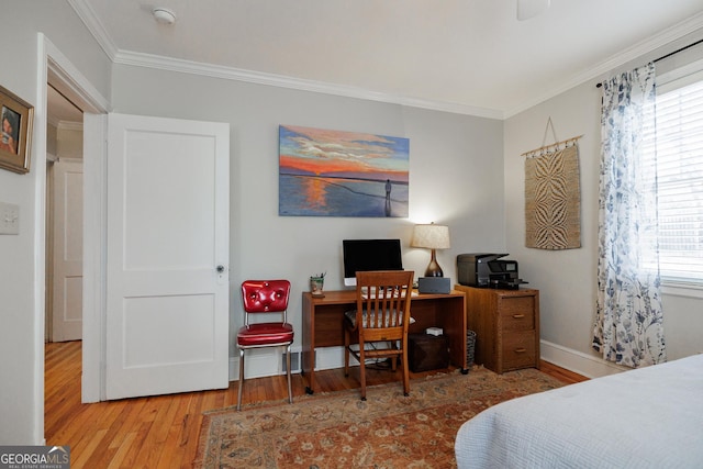 bedroom with hardwood / wood-style flooring and ornamental molding