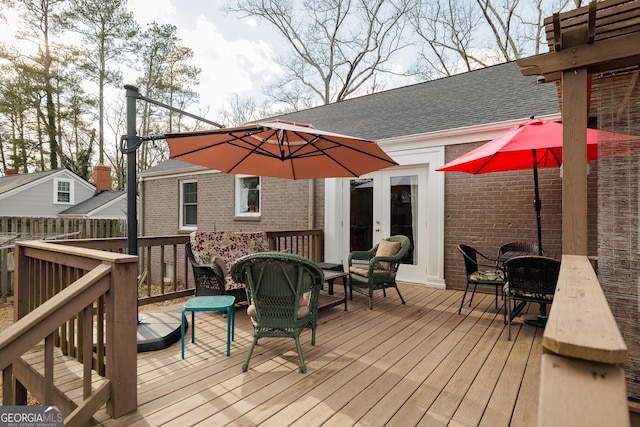 wooden deck featuring french doors