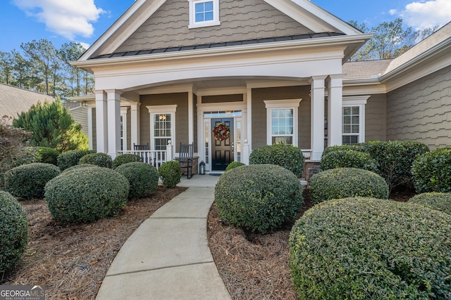 doorway to property featuring a porch